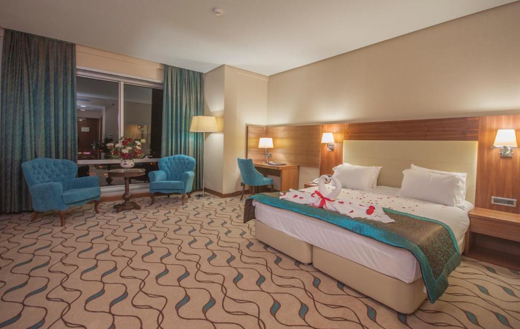 Postel nebo postele na pokoji v ubytování Margi Hotel