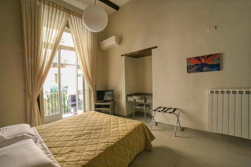 Łóżko lub łóżka w pokoju w obiekcie Casa Amato