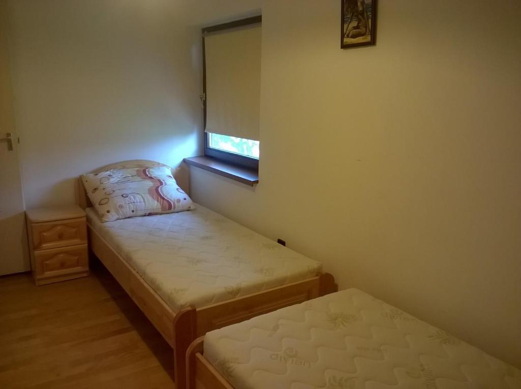 Postel nebo postele na pokoji v ubytování ZENITH APARTMAN