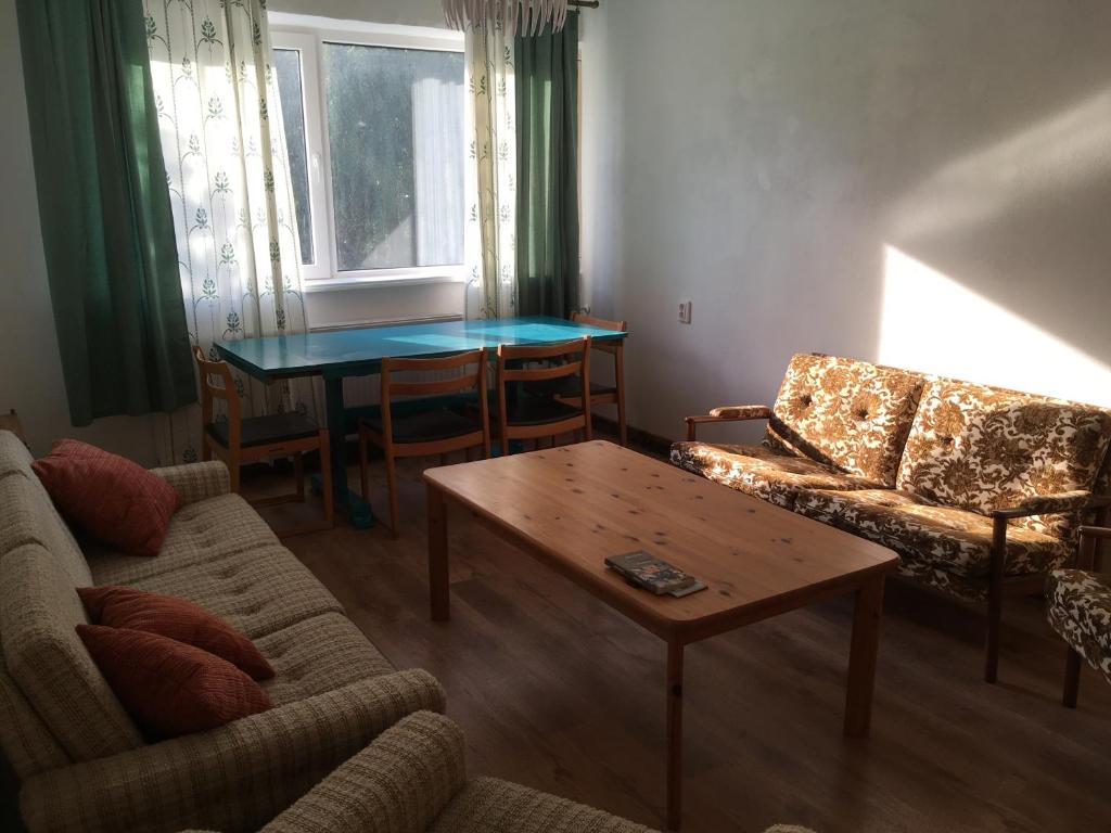 a living room with a couch and a table at Veriora apartment in Veriora