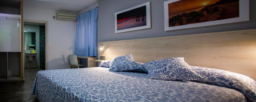 Posteľ alebo postele v izbe v ubytovaní Hotel Bari