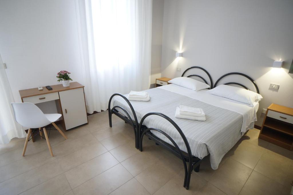 Postel nebo postele na pokoji v ubytování Hotel Mon Pays