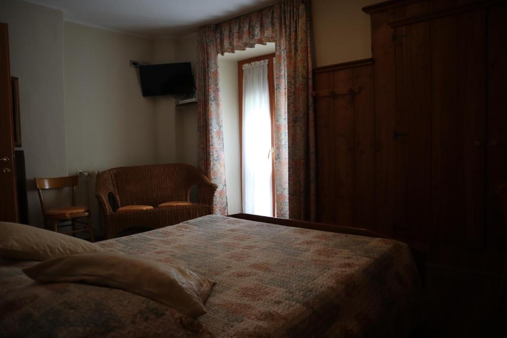 Postel nebo postele na pokoji v ubytování Albergo Del Ponte