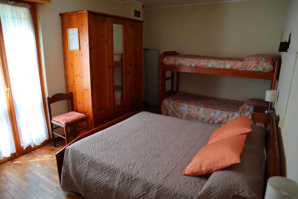 Postel nebo postele na pokoji v ubytování Albergo Del Ponte
