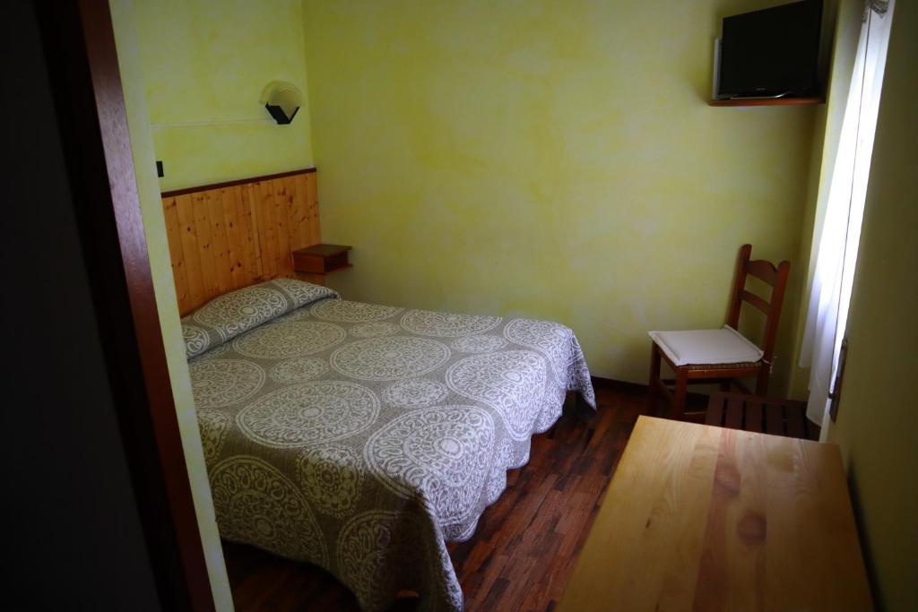 Postel nebo postele na pokoji v ubytování Albergo Del Ponte