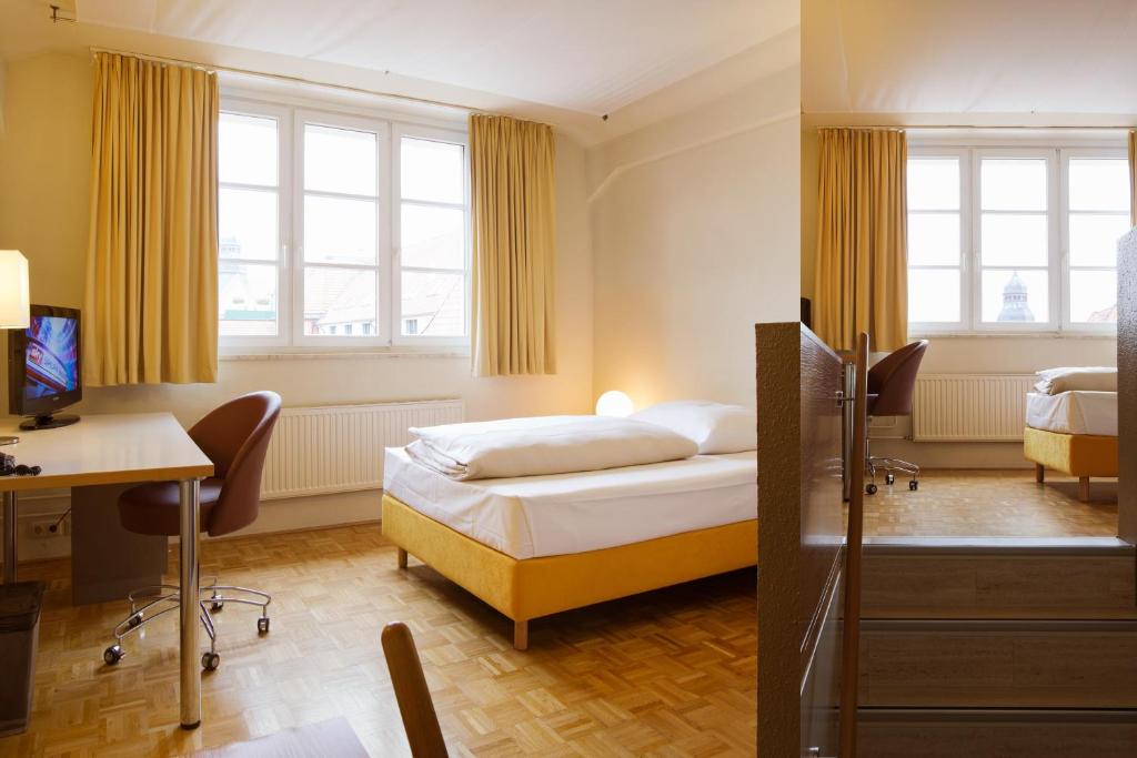Postel nebo postele na pokoji v ubytování Gästeresidenz PelikanViertel