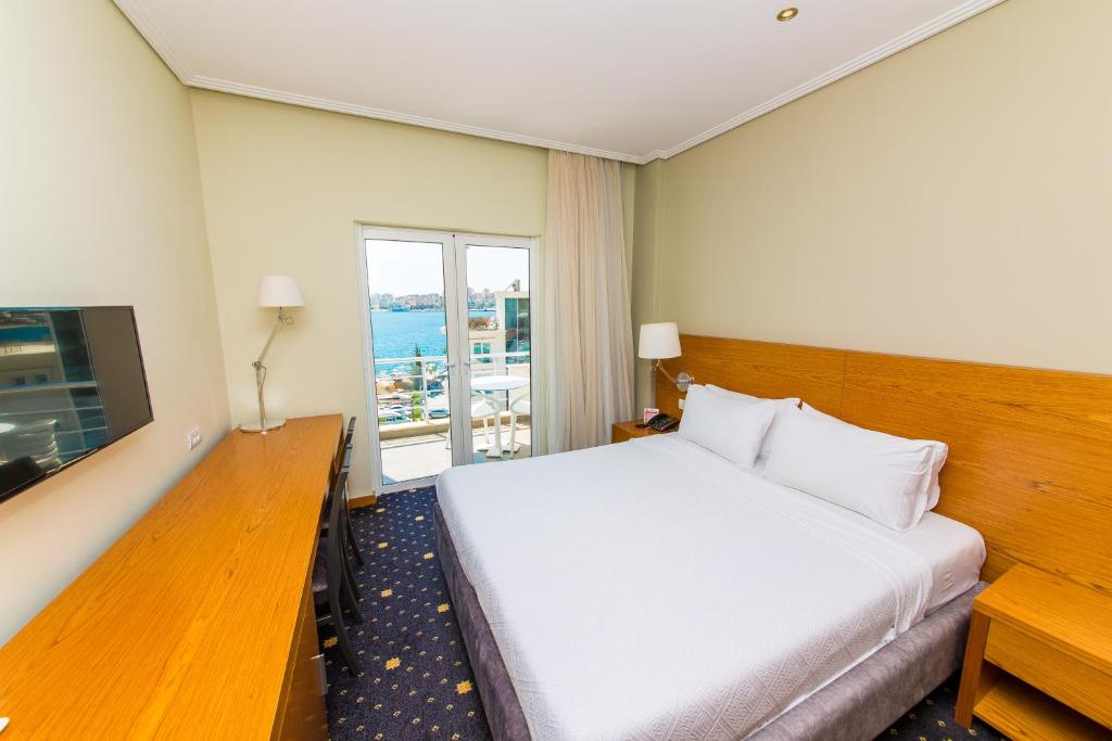 Postel nebo postele na pokoji v ubytování Hotel Agimi