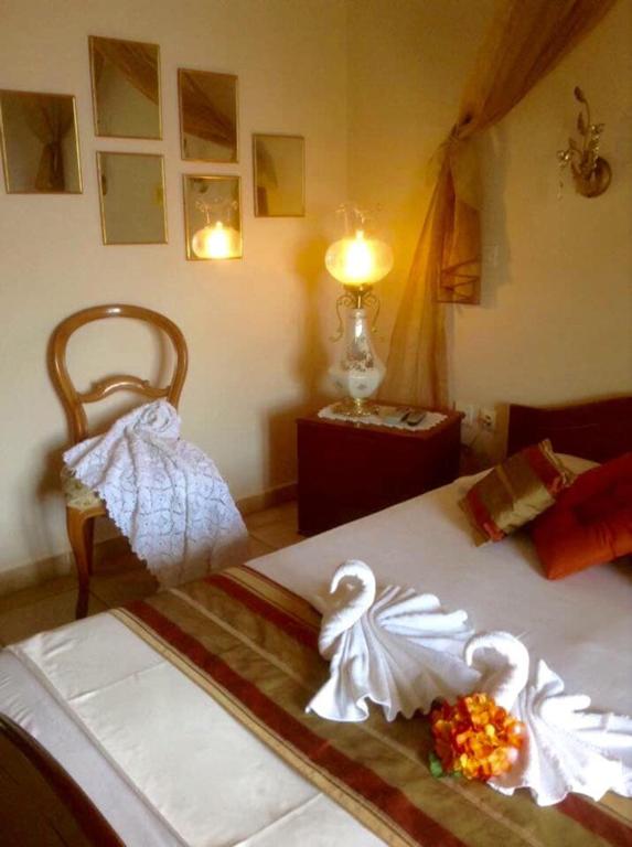 Postel nebo postele na pokoji v ubytování Saint George Hotel