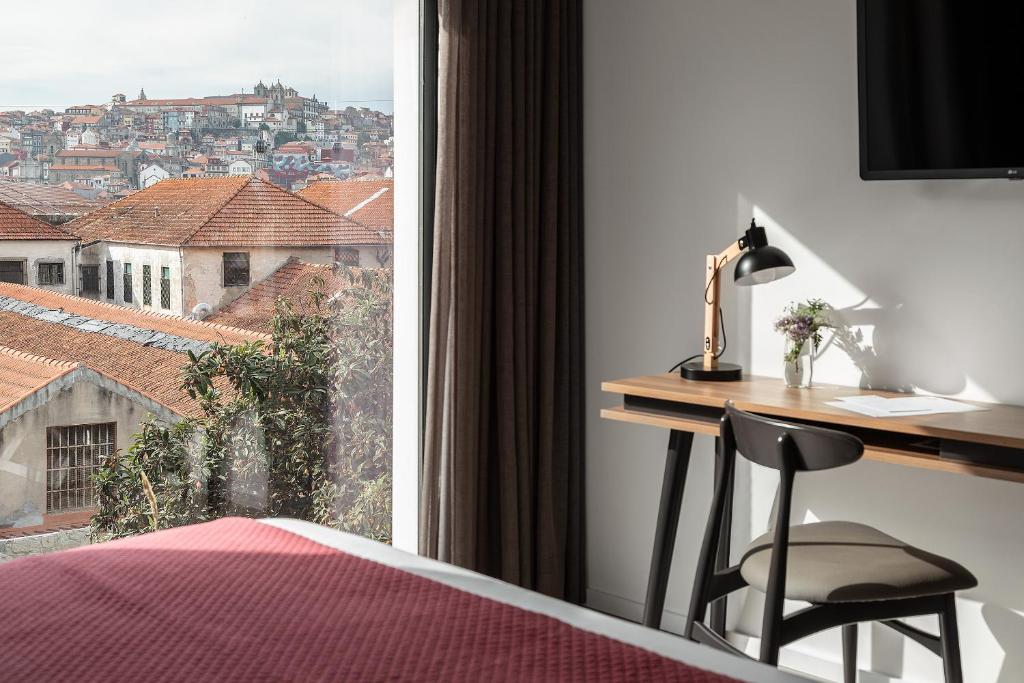 TV a/nebo společenská místnost v ubytování Caléway Hotel