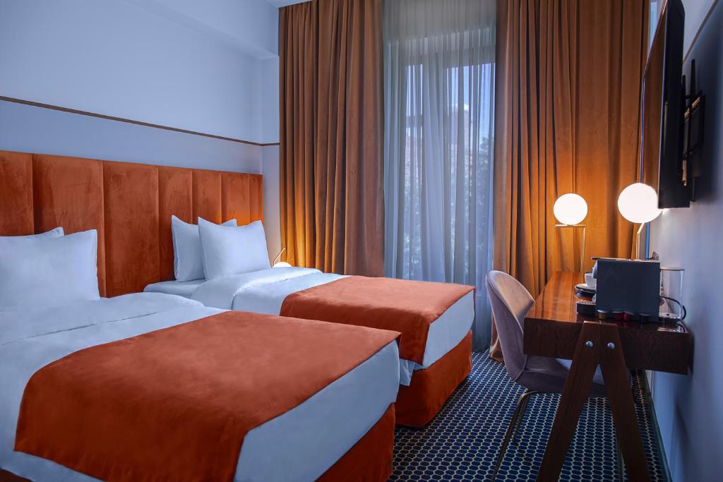 Postel nebo postele na pokoji v ubytování Zemeli Boutique Hotel by DNT Group