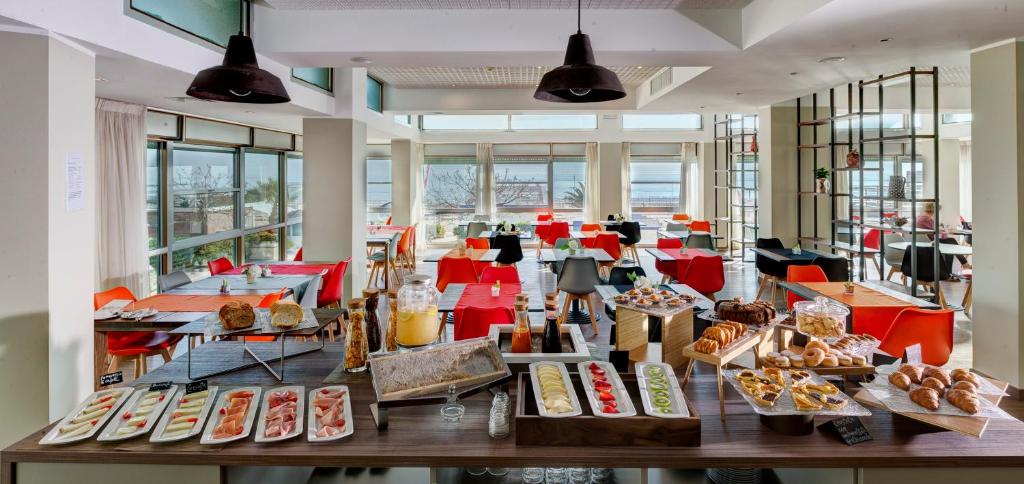 a bakery with many different types of pastries on display at Little Hotel in Riccione