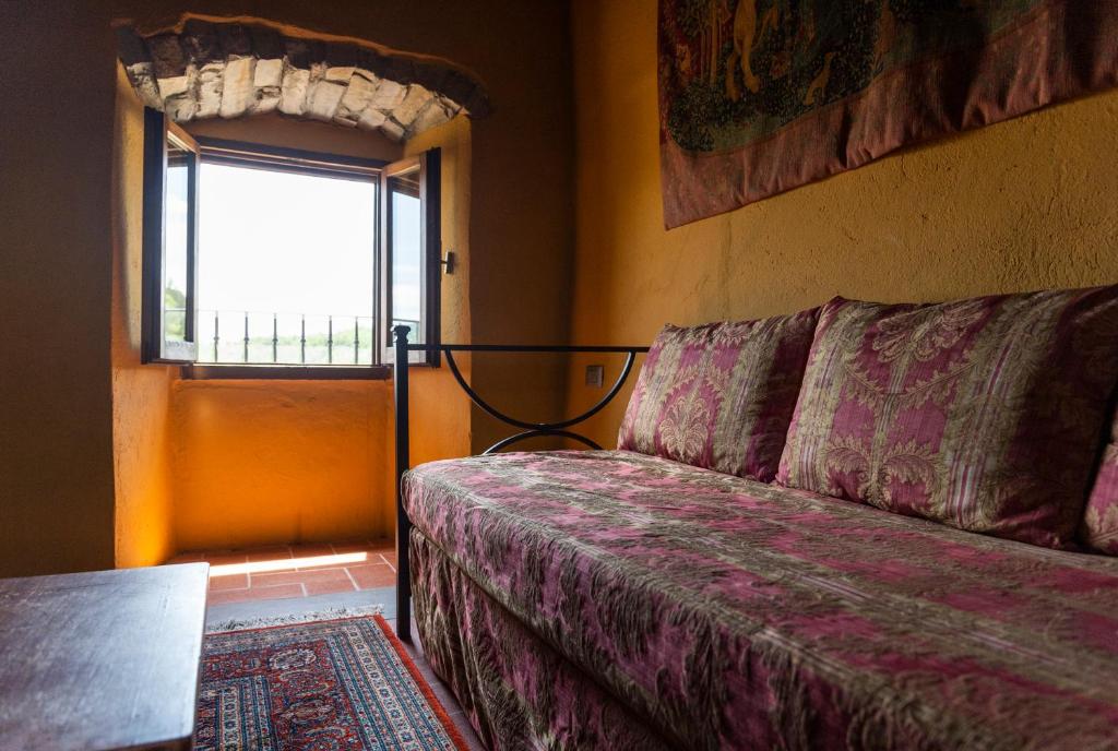 Postel nebo postele na pokoji v ubytování La Rimbecca Greve in Chianti