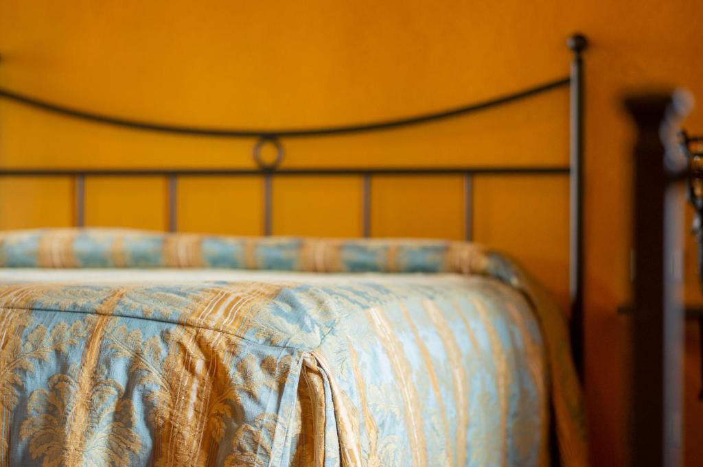 Postel nebo postele na pokoji v ubytování La Rimbecca Greve in Chianti