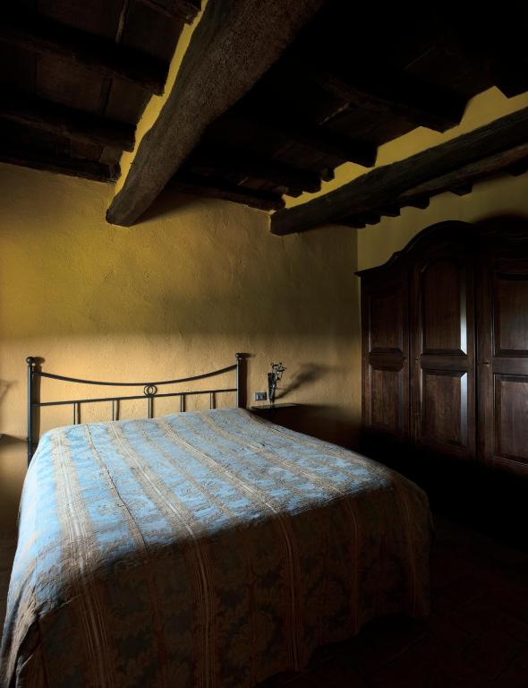 Postel nebo postele na pokoji v ubytování La Rimbecca Greve in Chianti