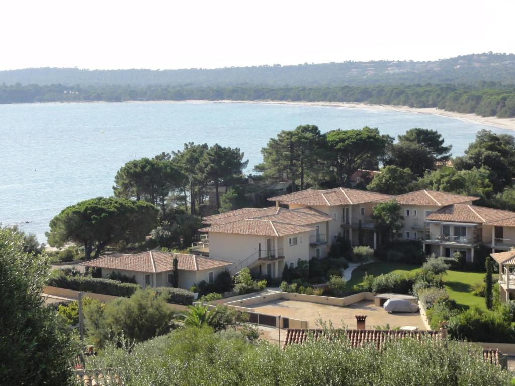 an aerial view of a villa next to the water at Résidence Coté Plage in Sainte-Lucie de Porto-Vecchio