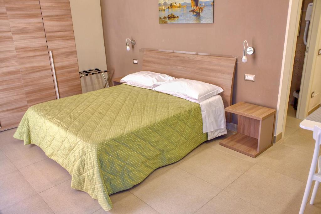 Łóżko lub łóżka w pokoju w obiekcie Casa Amato