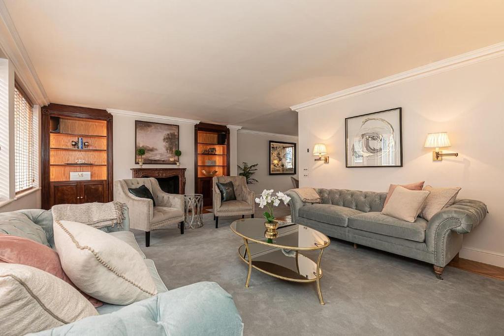 a living room with a couch and a table at Stunning 6-bed house near Harrods in Knightsbridge in London