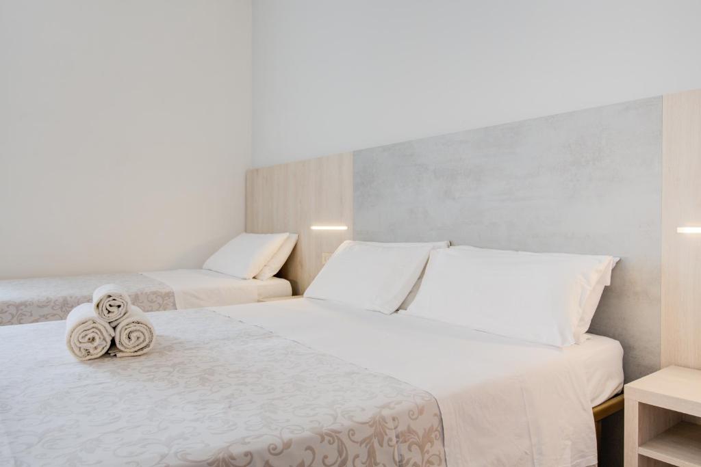 Postel nebo postele na pokoji v ubytování Hotel Olympia
