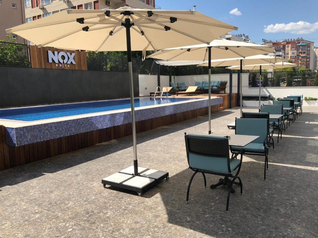 The swimming pool at or close to Nox Suite