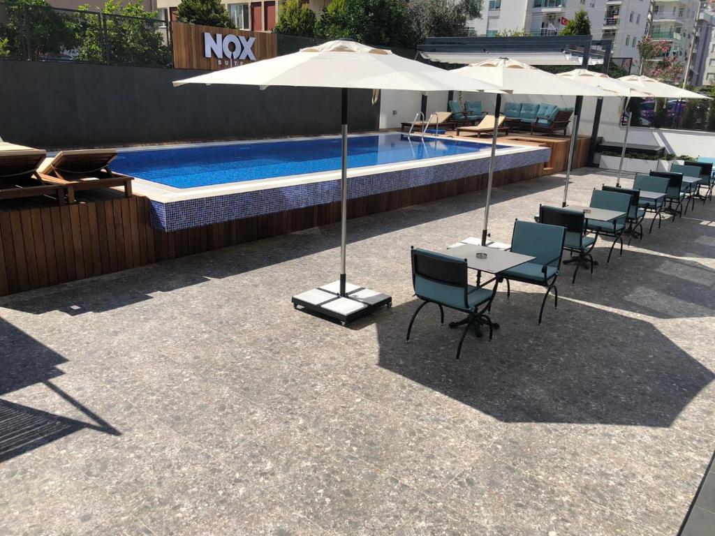 The swimming pool at or close to Nox Suite
