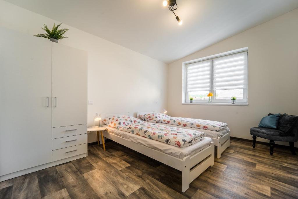 Postel nebo postele na pokoji v ubytování Na Mandlu