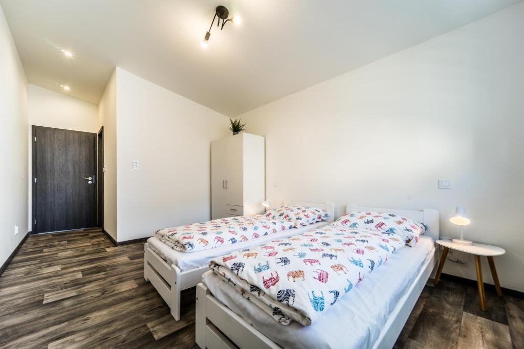 Postel nebo postele na pokoji v ubytování Na Mandlu