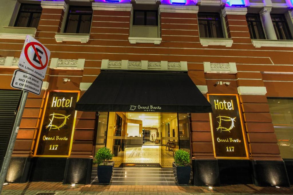 a store front of a building with a black awning at Hotel Grand Barão in Sao Paulo