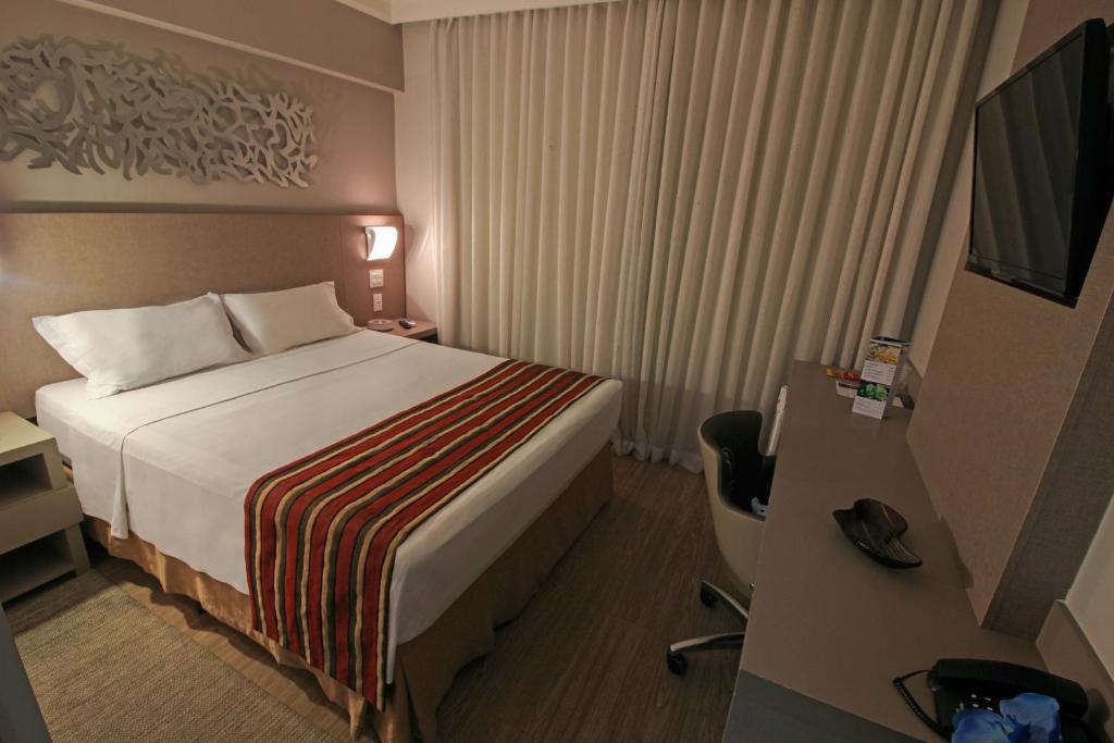 Cama ou camas em um quarto em Hotel Beaga Convention Expominas by MHB