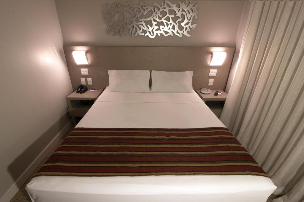 Cama ou camas em um quarto em Hotel Beaga Convention Expominas by MHB