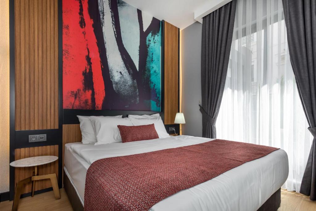 A bed or beds in a room at Nox Suite