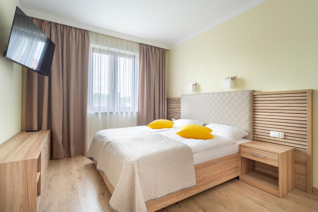 Posteľ alebo postele v izbe v ubytovaní Apartamenty Fregata