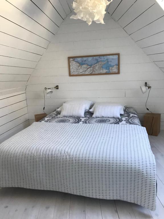 Ένα ή περισσότερα κρεβάτια σε δωμάτιο στο White and Sea Lodge