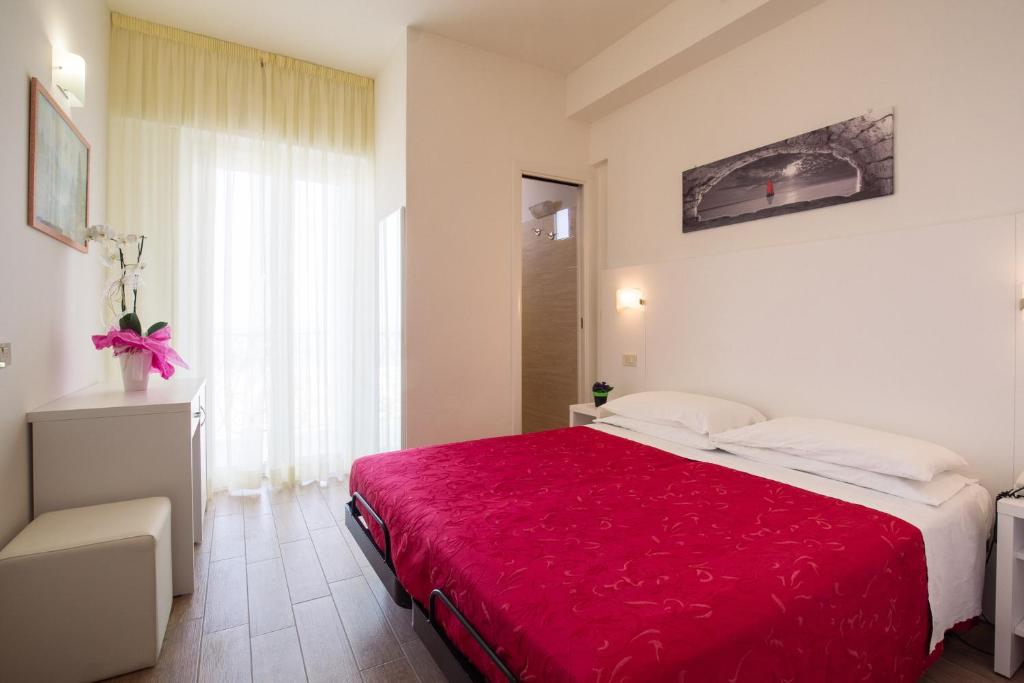 Postel nebo postele na pokoji v ubytování Hotel Lido