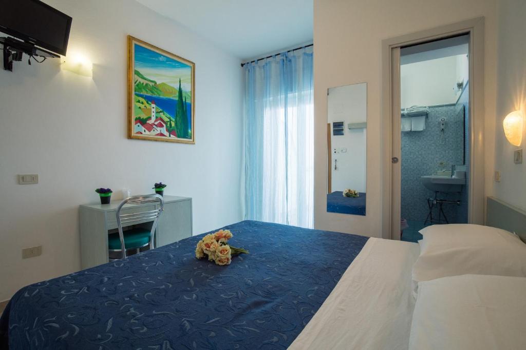 Postel nebo postele na pokoji v ubytování Hotel Lido
