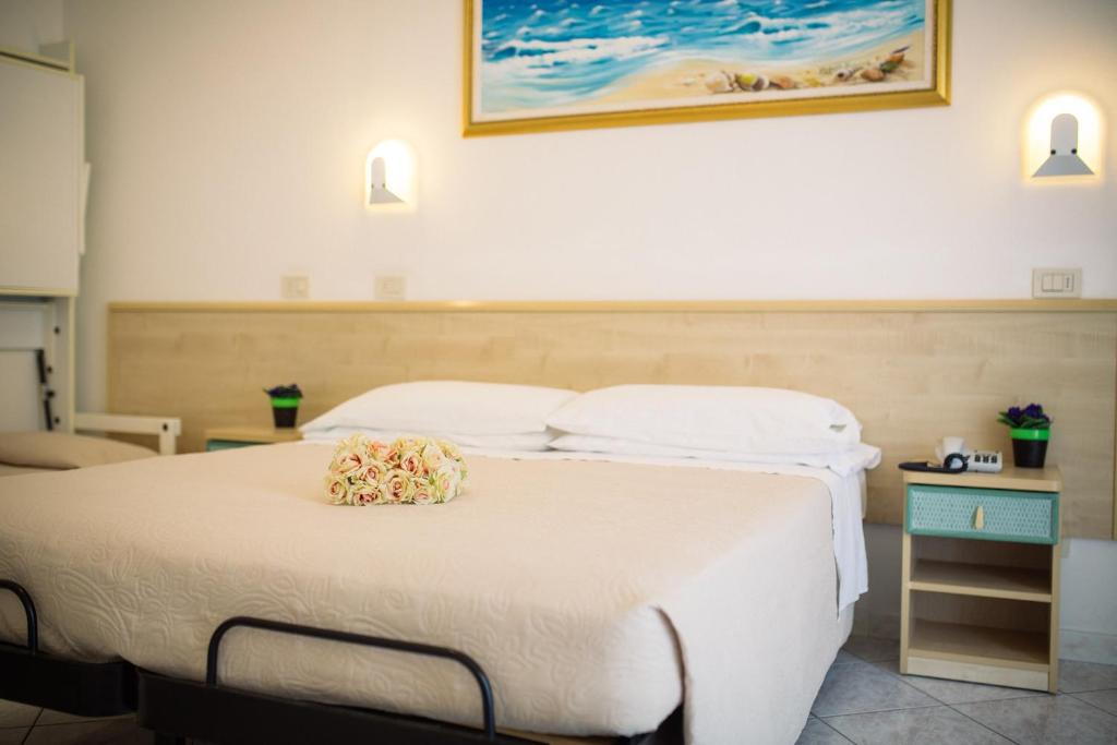 Postel nebo postele na pokoji v ubytování Hotel Lido