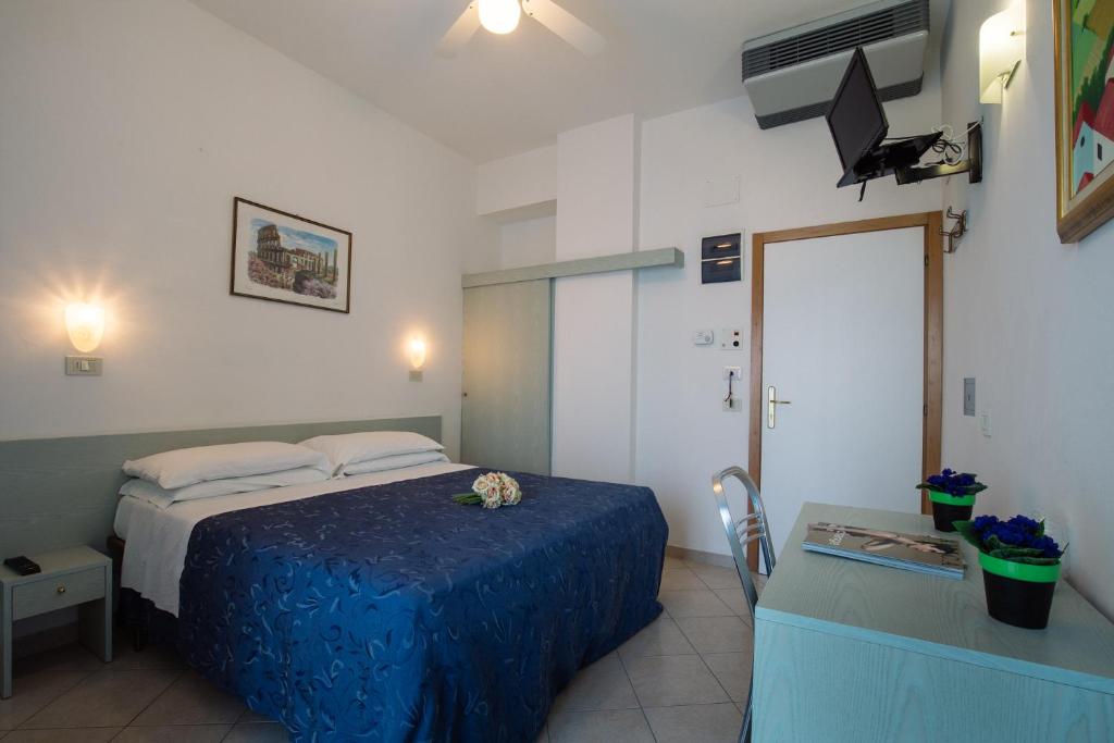 Postel nebo postele na pokoji v ubytování Hotel Lido
