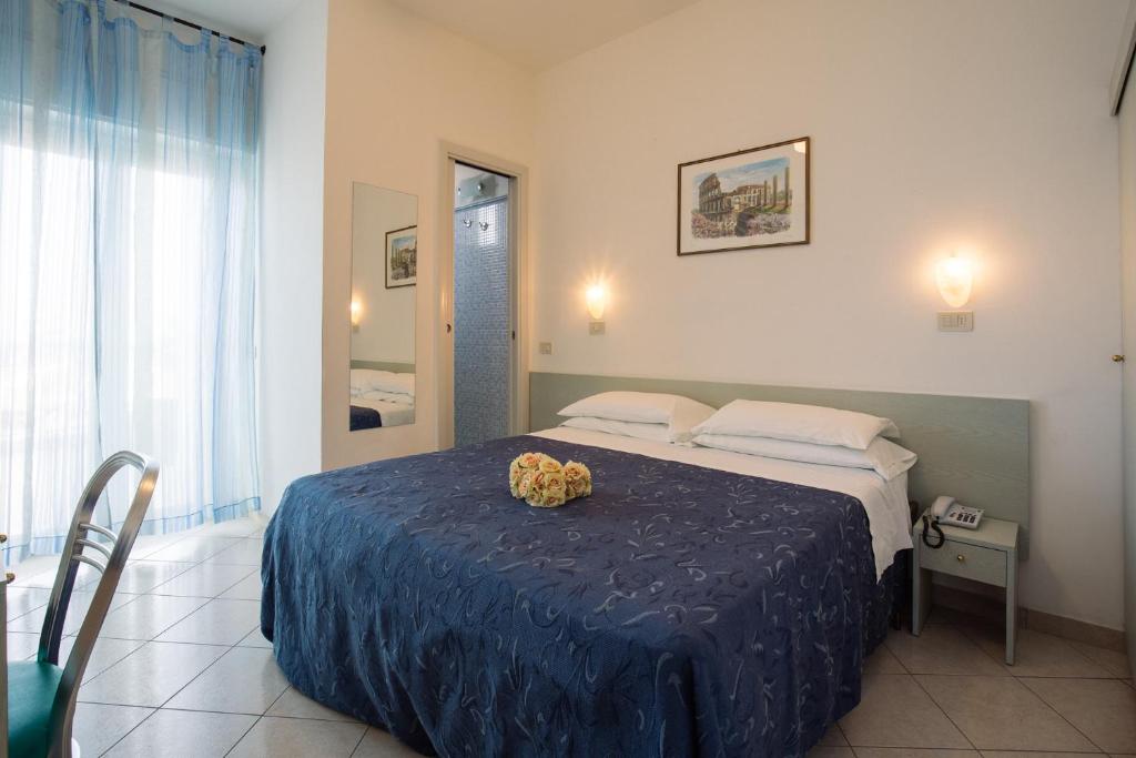 Postel nebo postele na pokoji v ubytování Hotel Lido