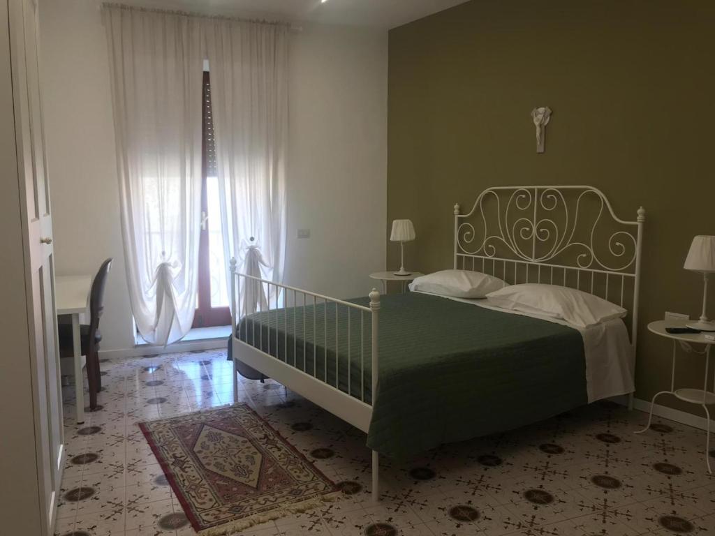 Postel nebo postele na pokoji v ubytování Maria Maddalena Holiday House
