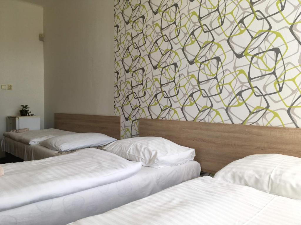 Postel nebo postele na pokoji v ubytování Hotel Jordánek