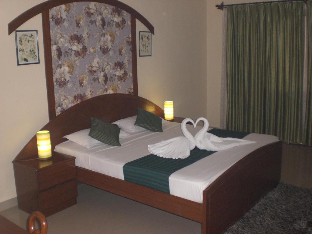 Кровать или кровати в номере A's Holiday Beach Resort