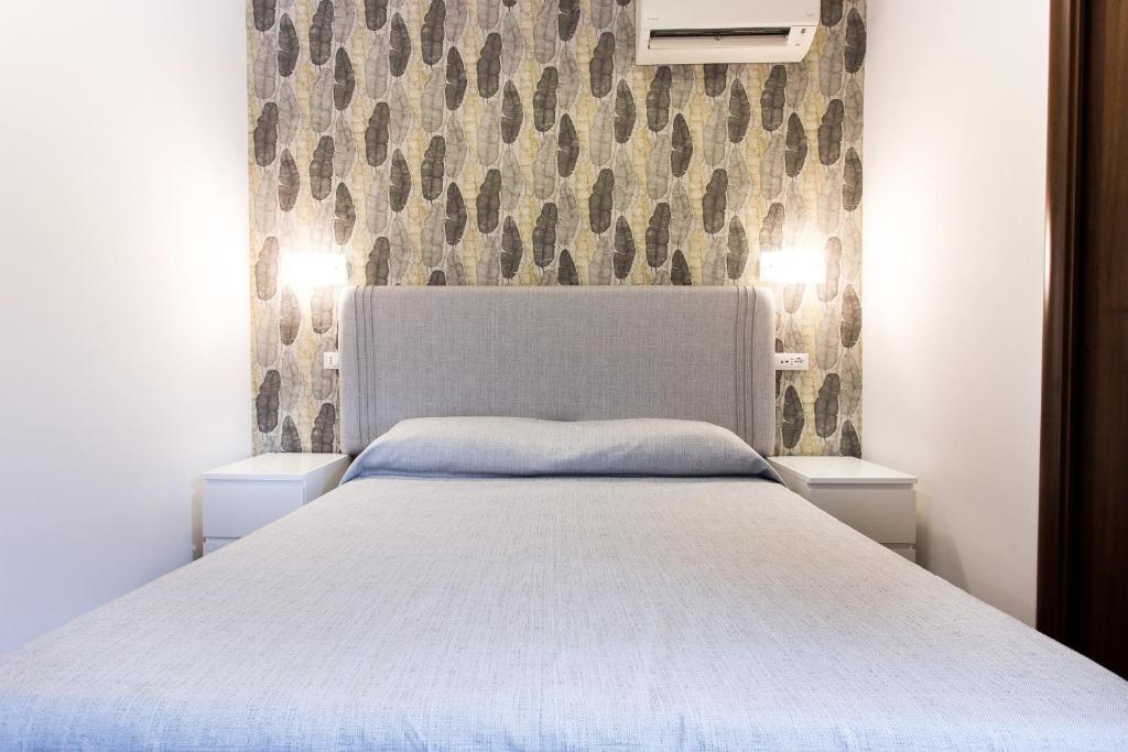 Postel nebo postele na pokoji v ubytování B&B Maria Rosaria