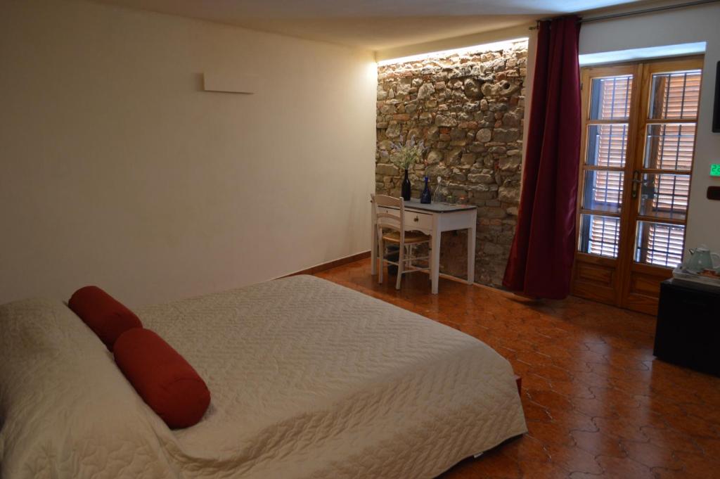 Postel nebo postele na pokoji v ubytování Casa Pulci