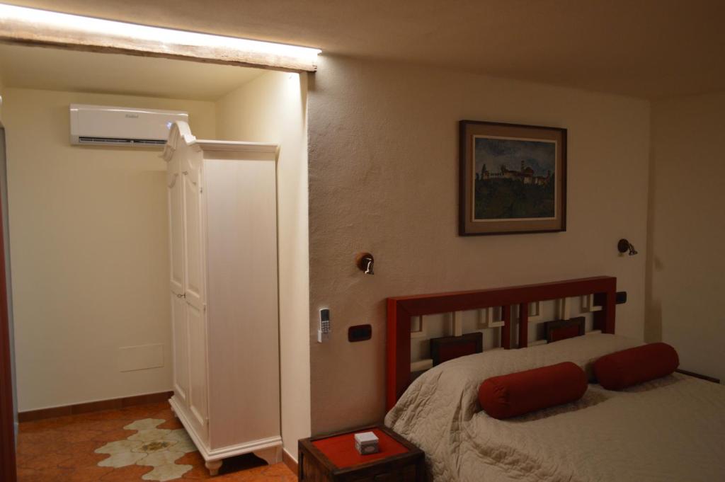 Postel nebo postele na pokoji v ubytování Casa Pulci