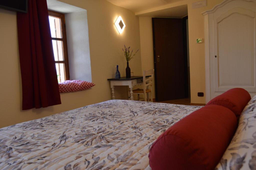 Postel nebo postele na pokoji v ubytování Casa Pulci