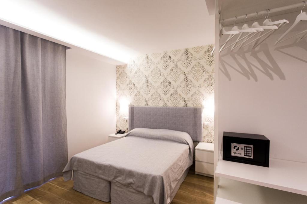 Postel nebo postele na pokoji v ubytování B&B Maria Rosaria