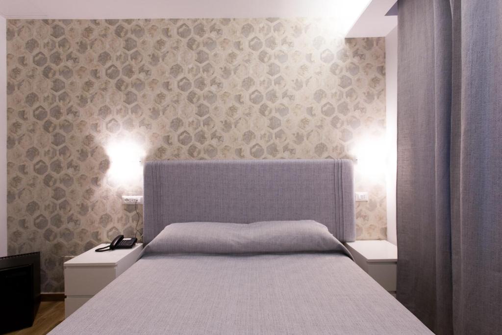Postel nebo postele na pokoji v ubytování B&B Maria Rosaria