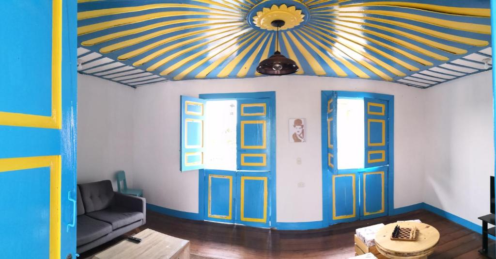 a living room with a room with a ceiling at Hotel Salento 1842 in Salento