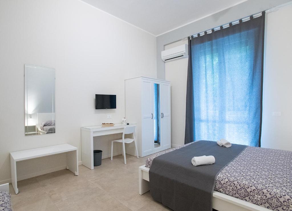 Posteľ alebo postele v izbe v ubytovaní Le Stanze Dell'Emiro