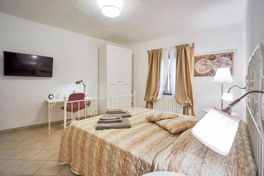 Un pat sau paturi într-o cameră la Casa Laurentius