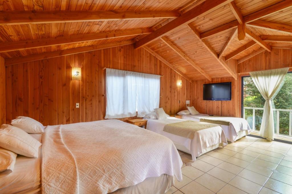 Postel nebo postele na pokoji v ubytování Hola Pucon